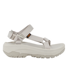 The Teva Womens Hurricane XLT2 Ampsole Moonstruck is a beige sport sandal with thick, textured sole, adjustable fabric straps with heel and ankle support, a side Teva logo tag, and is made from recycled materials.