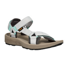 The Teva Womens Hydratrek Sandal in White/Taupe features adjustable recycled polyester straps, a cushioned tan sole with patterned sides, and a black textured outsole with traction technology, pictured on a white background.