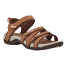 The Teva Womens Tirra Leather Brown sandal features adjustable straps, a cushioned footbed, and a rugged rubber sole for enhanced arch support and comfort. The Teva logo appears on one strap.