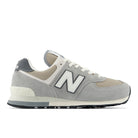 NEW BALANCE Unisex 574 Grey/Beige sneaker with suede and mesh upper and ENCAP cushioned midsole, side view.