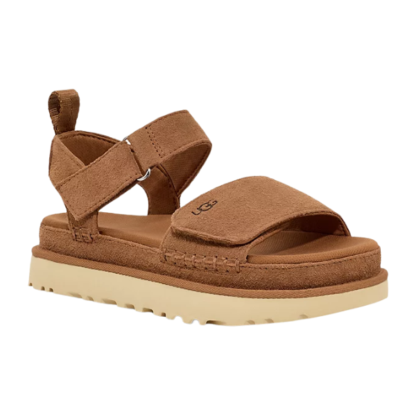 The UGG Womens Goldenstar Chestnut sandal features brown suede, a thick pale rubber sole, open toe, adjustable Velcro ankle strap for comfort, and the UGG logo on the front strap.