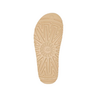 The UGG Womens Goldenstar Chestnut features a beige sole with a geometric tread of radiating lines and sunburst patterns. UGG and SugarSole are embossed at the center and heel, providing support for lasting comfort.