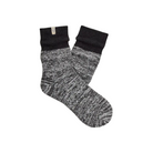 The UGG Women's Rib Knit Slouchy Quarter Black socks feature cozy black and gray marled knit, thick ribbed cuffs, and a small beige UGG tag—perfect for lounging in style.