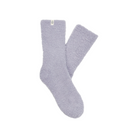 The UGG Women's Teddi Cozy Crew Cloudy Grey socks by UGG are light purple fuzzy crew socks with a small white tag at the top, made from recycled polyester and shown on a plain white background.