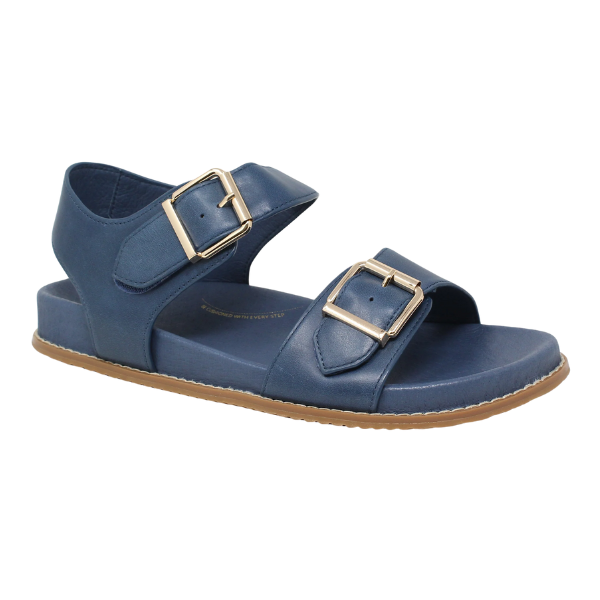The ZIERA Womens Hastice Blue Leather sandal features two adjustable gold buckles, a brown rubber sole, and is designed for foot pain relief. Inspired by the iconic Ziera Hastice style.