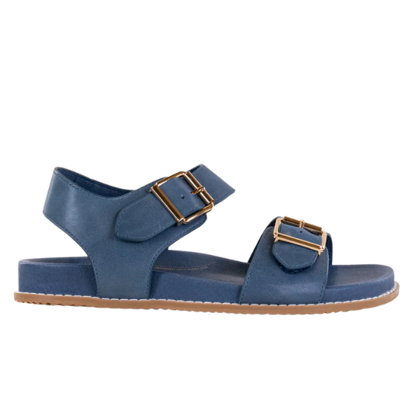 The ZIERA Womens Hastice Blue Leather sandal features a flat sole, tan bottom, open toe, ankle strap, and two gold-tone buckles—designed for stylish comfort and foot pain relief. Side view shown.