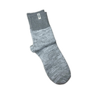 The UGG Women's Rib Knit Slouchy Quarter Seal is a single gray quarter sock with a ribbed cuff and subtle UGG branding, offering cozy comfort—perfect for everyday wear.