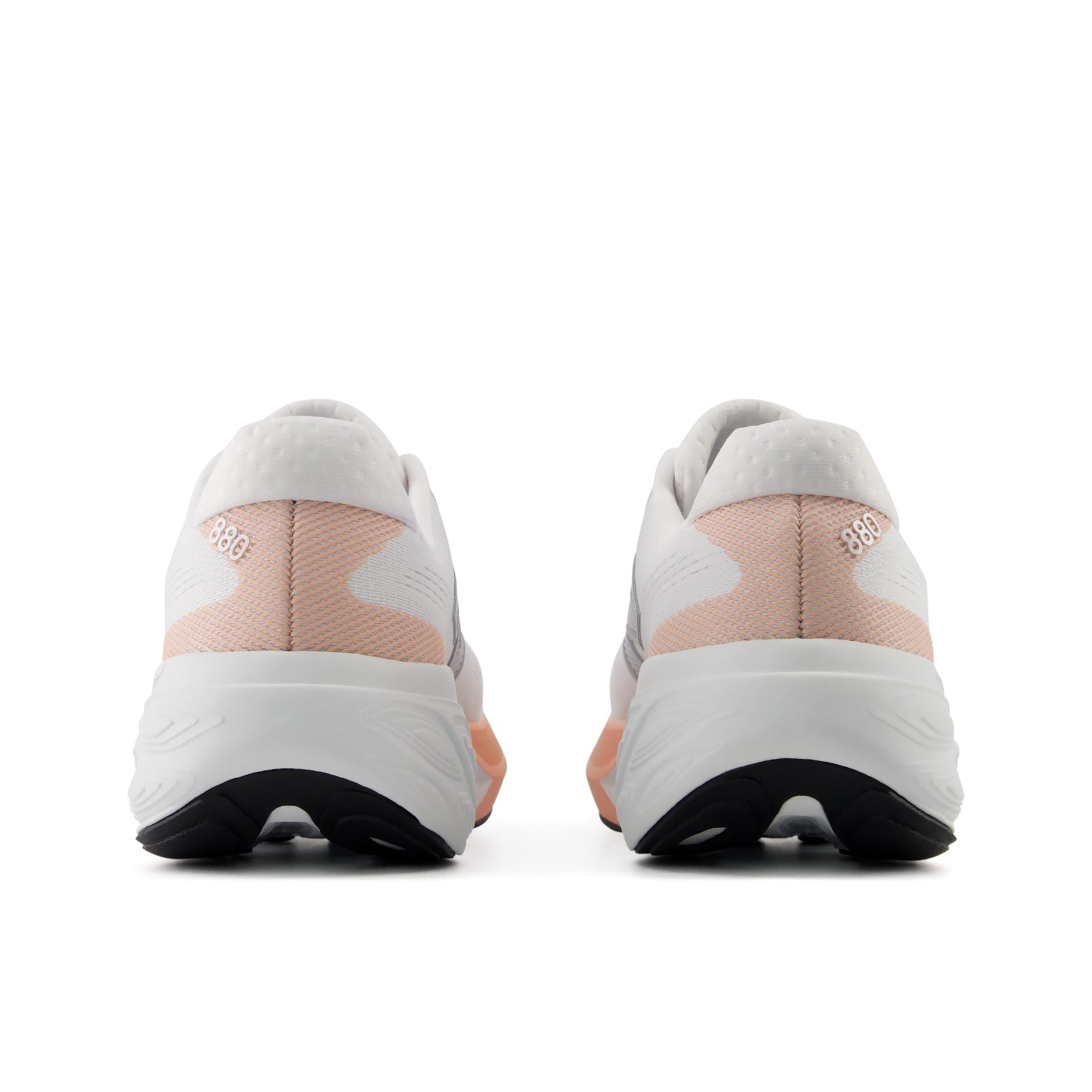 Rear view of New Balance Women's 880 V15 White/Orange sneakers with black soles on a white background.