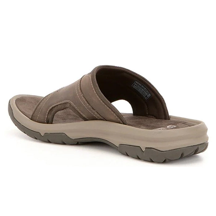 The Teva Mens Langdon Slide Walnut features a thick, cushioned sole and Wide, sturdy strap for style and foot pain relief. Shown from a rear side angle on a white background.