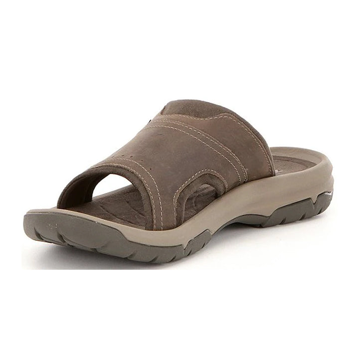 The Teva Mens Langdon Slide Walnut features a brown leather upper, textured sole, and open toe design—shown angled on a white background—for everyday comfort and foot pain relief.