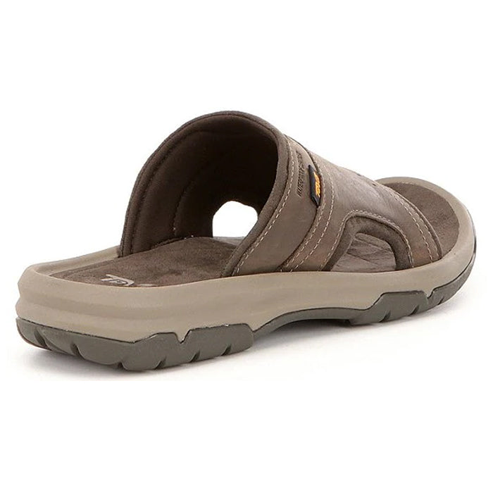 The Teva Mens Langdon Slide Walnut features a Wide leather strap, thick cushioned sole, and textured gray outsole, shown from the back and side to highlight its comfort-focused design by Teva.