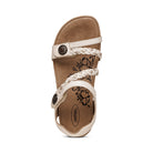 The Aetrex Womens Jillian Ivory sandal features braided straps, a floral-print insole, round metal buckles, and plush memory foam cushioning for comfort. Shown in ivory against a white background.