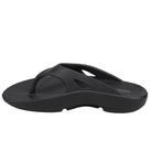 The Sovella Womens PF Thong Black is a womens comfort sandal from Sovella, featuring a contoured footbed, thick sole, and added arch support. Shown in black from the side against a white background.