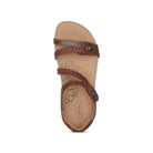 Top view of the Aetrex Womens Jillian Walnut sandal by Aetrex, with braided adjustable straps, decorative buttons, a floral-patterned tan insole, open toe and heel design, and an orthotic footbed for enhanced comfort.